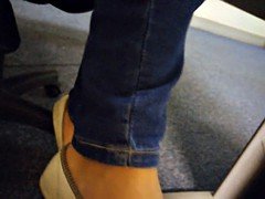 Girl very stink feet and dangling in flats on office