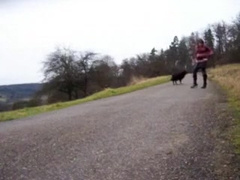 Tranny sitting on Parkbench near road