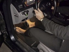 Young businessman getting off while cranking his Mercedes