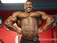 Beefy Muscleman shows off impressive front lat spreads in tight posing trunks