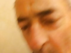 Faggot eating more cum from a public urinal