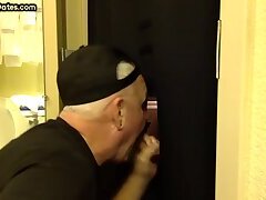 Dirty gay men sucks and jerks off cock in gloryhole