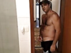 Hairy gay wears shorts while jacking his cock