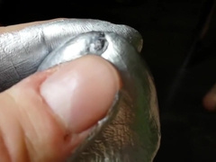 Oiled cock with silver paint