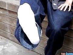 Kinky blond twink teases with his feet while smoking outdoor