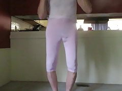 Crossdresser in tight pink shows his sissy ass and bulge.