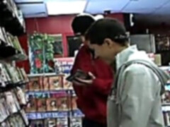 Dude sucking on a big gay dick at the video store gloryhole