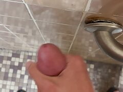 SlimSean cumming in a public bathroom