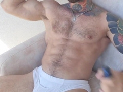 Muscle guy smoking at balcone and displays humungous manstick