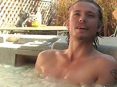Fit jock relaxes in an outdoor jacuzzi and masturbates solo