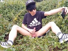 Adorable French-Asian twink Jon Arteen jerks off his smooth cock outdoors, leaving thick cum on his fingers