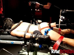 Chained jock Devin Franco lying face down being fisted in his ass