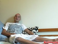 Stud jerking cock on his bed before cumming