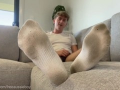 Aussie dude talks dirty while stroking off in messy white socks flaunting his feet