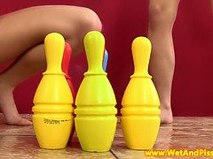 Watch these kinky babes get off with pissing and bowling pins in close-up action