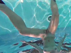 Hot brunette slut Candy swims underwater