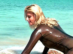 Veronica dressing in spandex on the beach