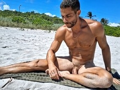 Athletic guy Andrearmani shows off his smooth bubble butt while doing nude yoga at a Rio beach