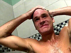 2 wild heterosexual hunks taking a shower together