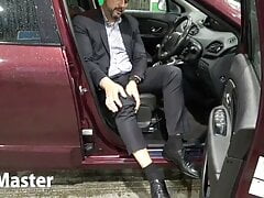 Suited Man pumps pedals of car PREVIEW