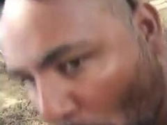 Bear Sucks and Swallows Outdoors