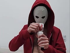 Masked guy tries out a fleshlight for the first time