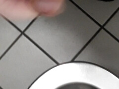 Playing with cock in a public toilet