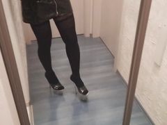 crossdresser in stripper high heels stockings and latex mini