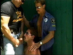 Two horny jacked gay cops and a hot perp get some sucking outside