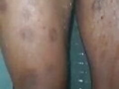 Bearded black dad taking a shower.