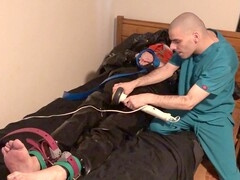 Rubber Boy in Leather Bondage