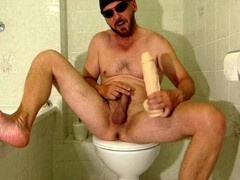 Wild bathroom antics with a fake cock and golden showers