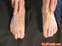 Muscled shaved man Anthony taunting and frolicking with his soles