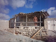 naked man at a fishing hut