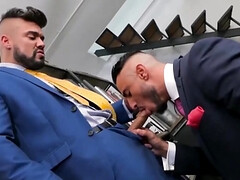 Wearing a suit and having office sex with a tall hunk