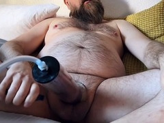 Hairy daddy bear strokes his massive dick, oozing precum and shooting a huge load