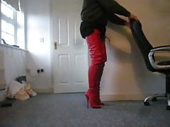 Standing in red crotch high ballet Boots