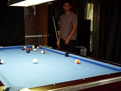 Two men with big cocks are banging a lad on the table