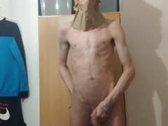 Highly softcore thin teenie puts a paper bag over his head and ripples his assets