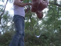 Hanging upside down in the middle of the park after working out