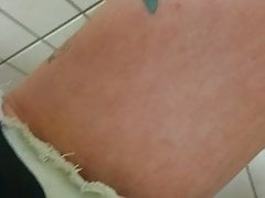 Barefoot on a filthy public toilet and tapping some piss
