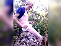 youthfull platinum-blonde Boy Fun in the forest