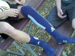 Outdoor gay twink gets tickled in public while showing off his soles