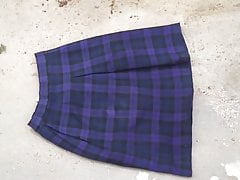 trample & crush soil on purple tartan skirt