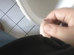Small erect uncut willy wanked to climax at a urinal