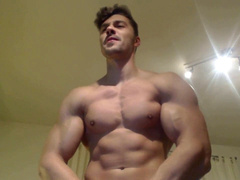 Strong young muscle deity showcases massive biceps and effortlessly lifts me overhead