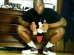 College jock stretches out gluts before basketball practice