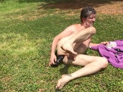 Doug Stratemeyer enjoys outdoor anal play with ass plug and dildo