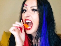 Dominatrix Nika indulges in her food fetish by chewing gummies