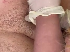 Handjob with lubed white gloves and huge cumshot